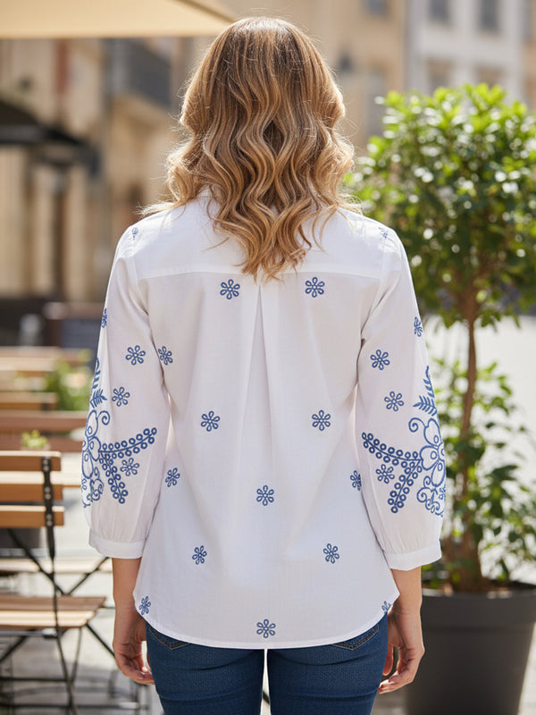 Elegant White Button-Down Shirt with Blue Floral Detailing