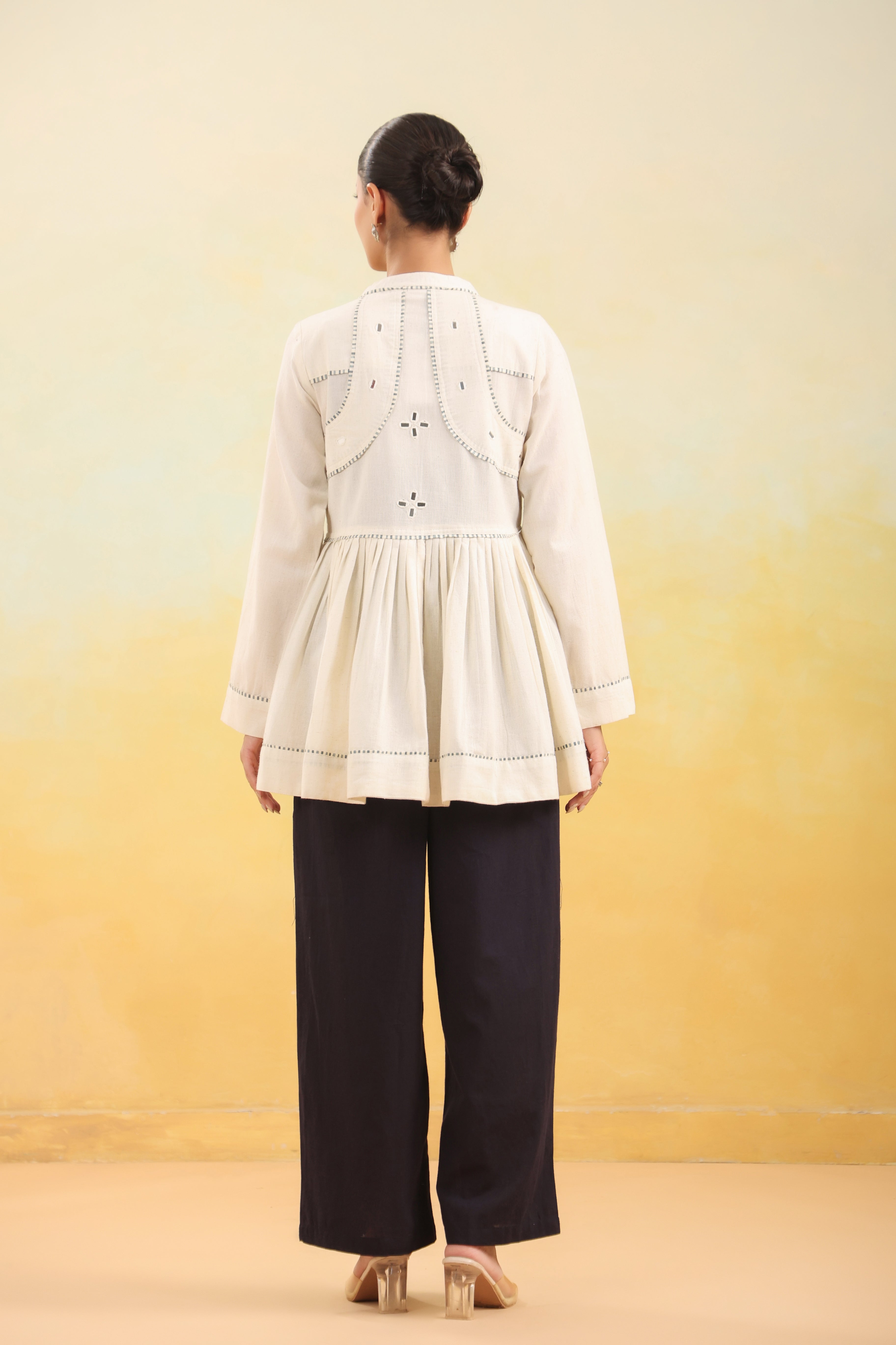 Women Off White Embroidered Peplum Top with Black Straight Pants Set