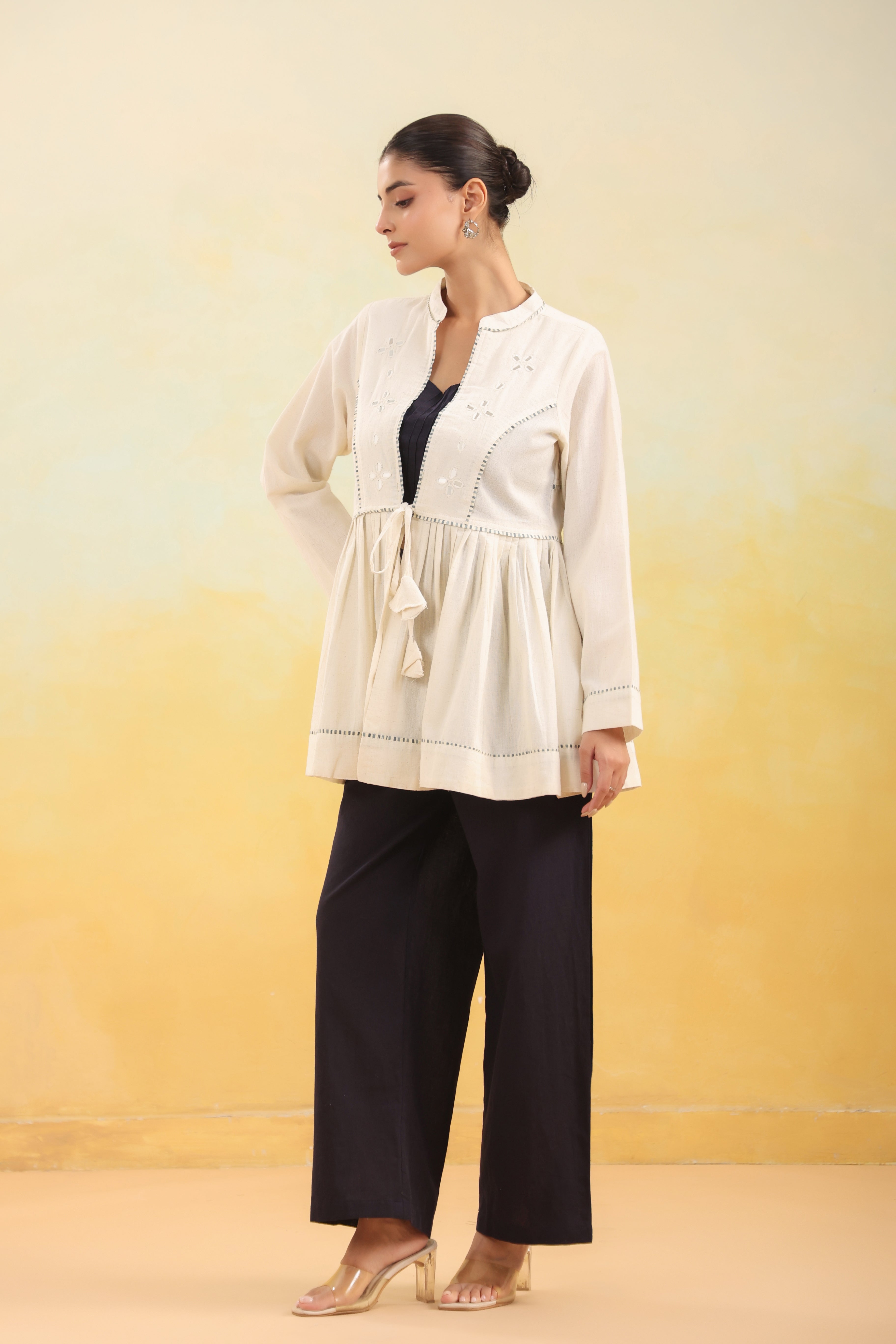 Women Off White Embroidered Peplum Top with Black Straight Pants Set