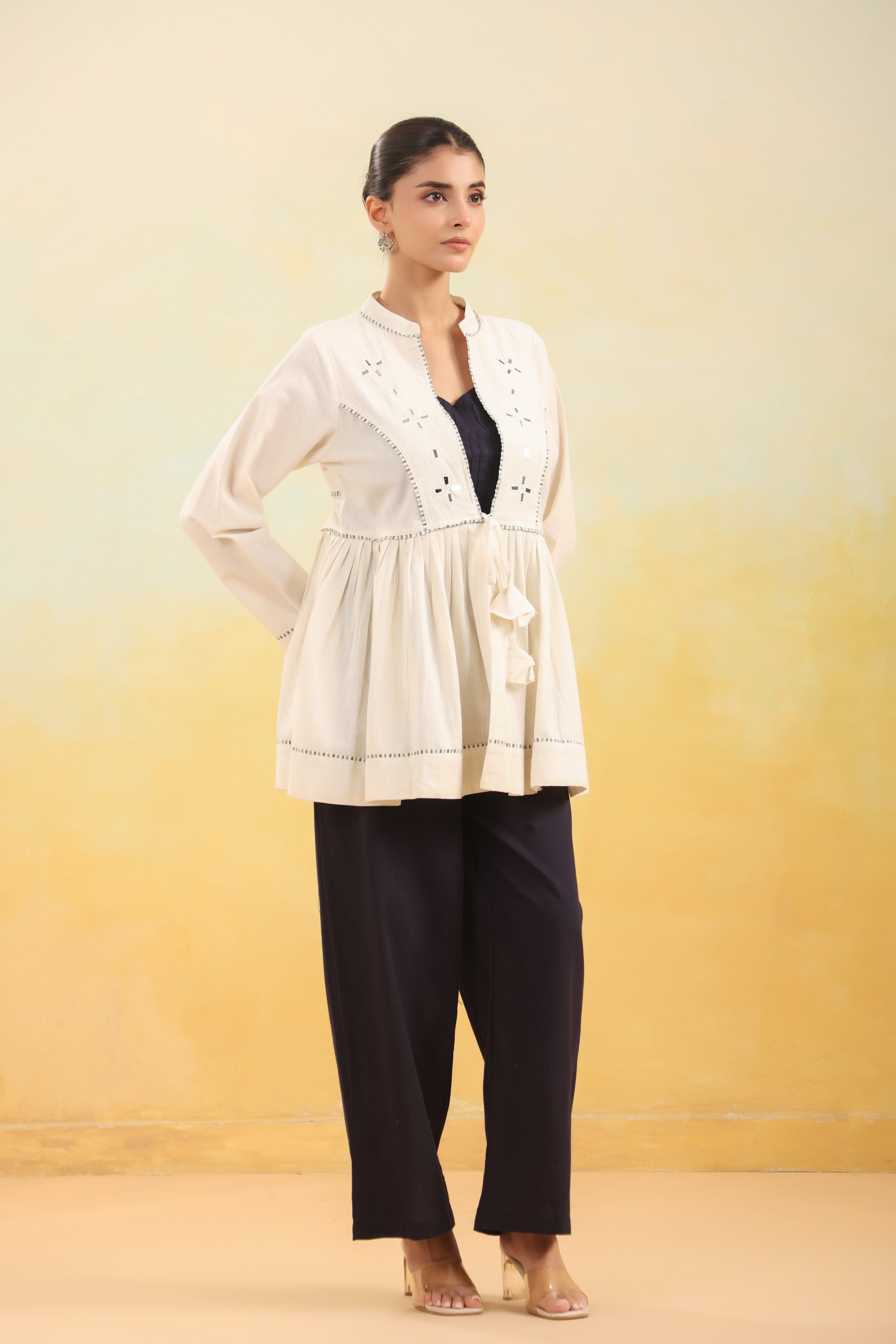 Women Off White Embroidered Peplum Top with Black Straight Pants Set