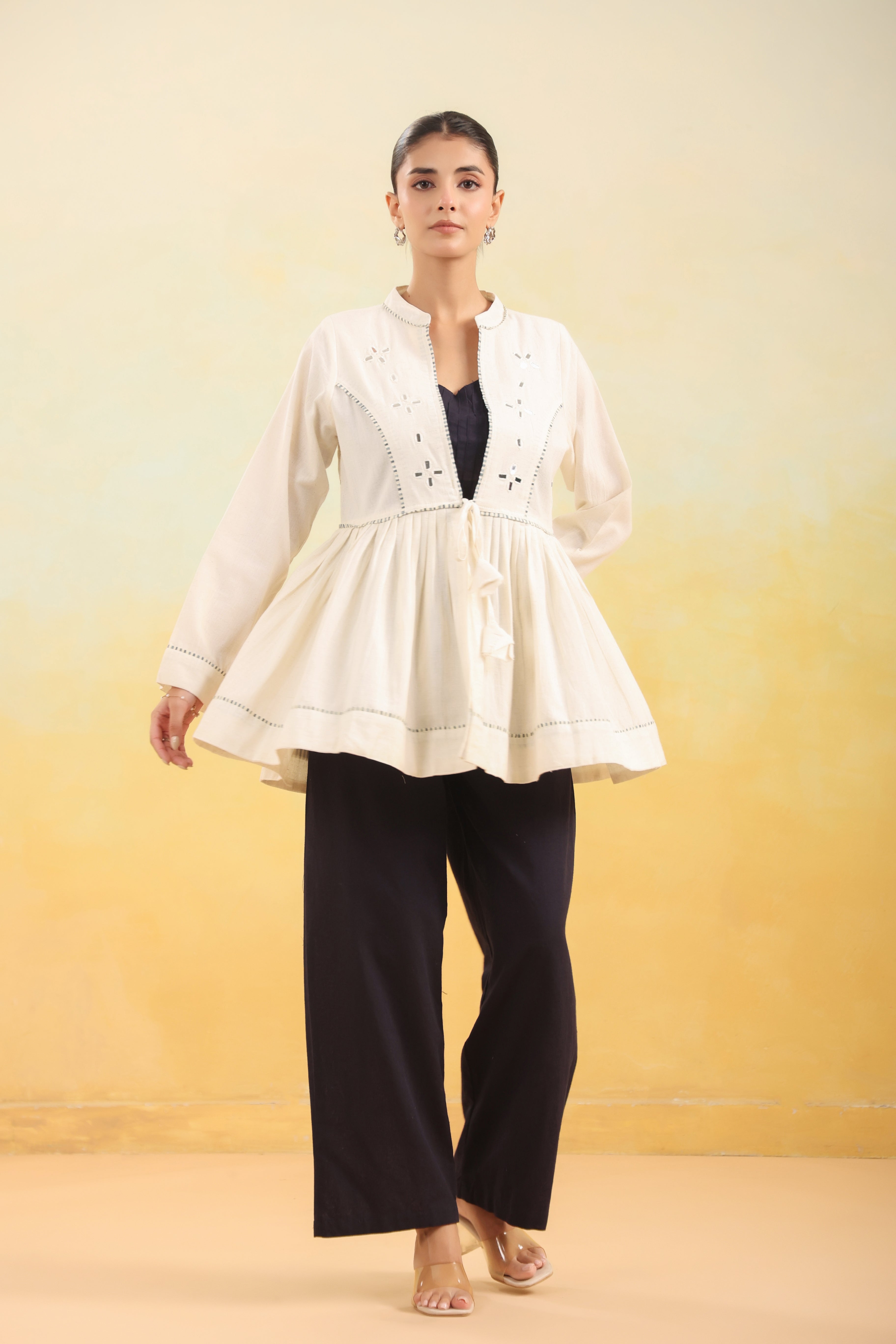Women Off White Embroidered Peplum Top with Black Straight Pants Set