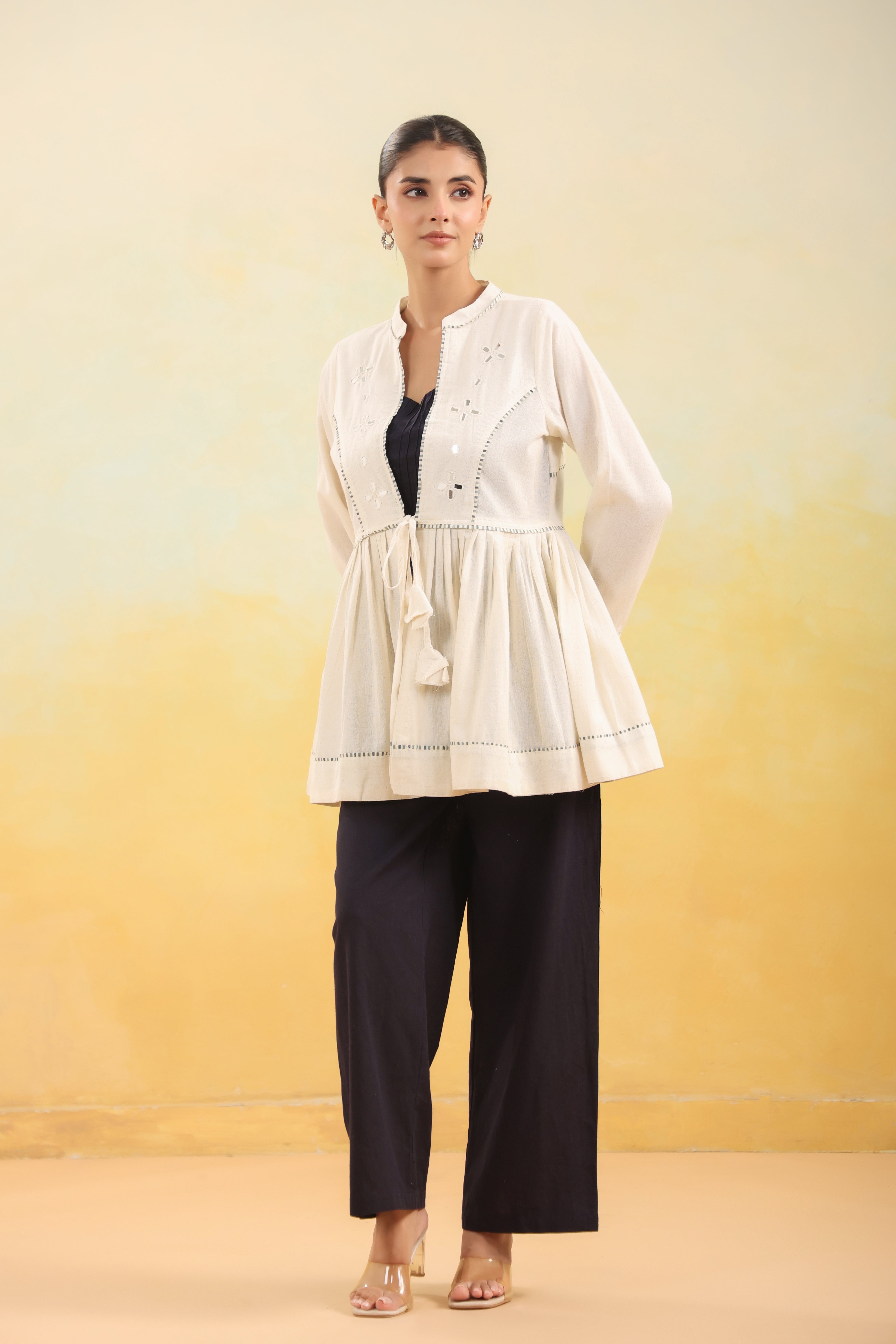 Women Off White Embroidered Peplum Top with Black Straight Pants Set