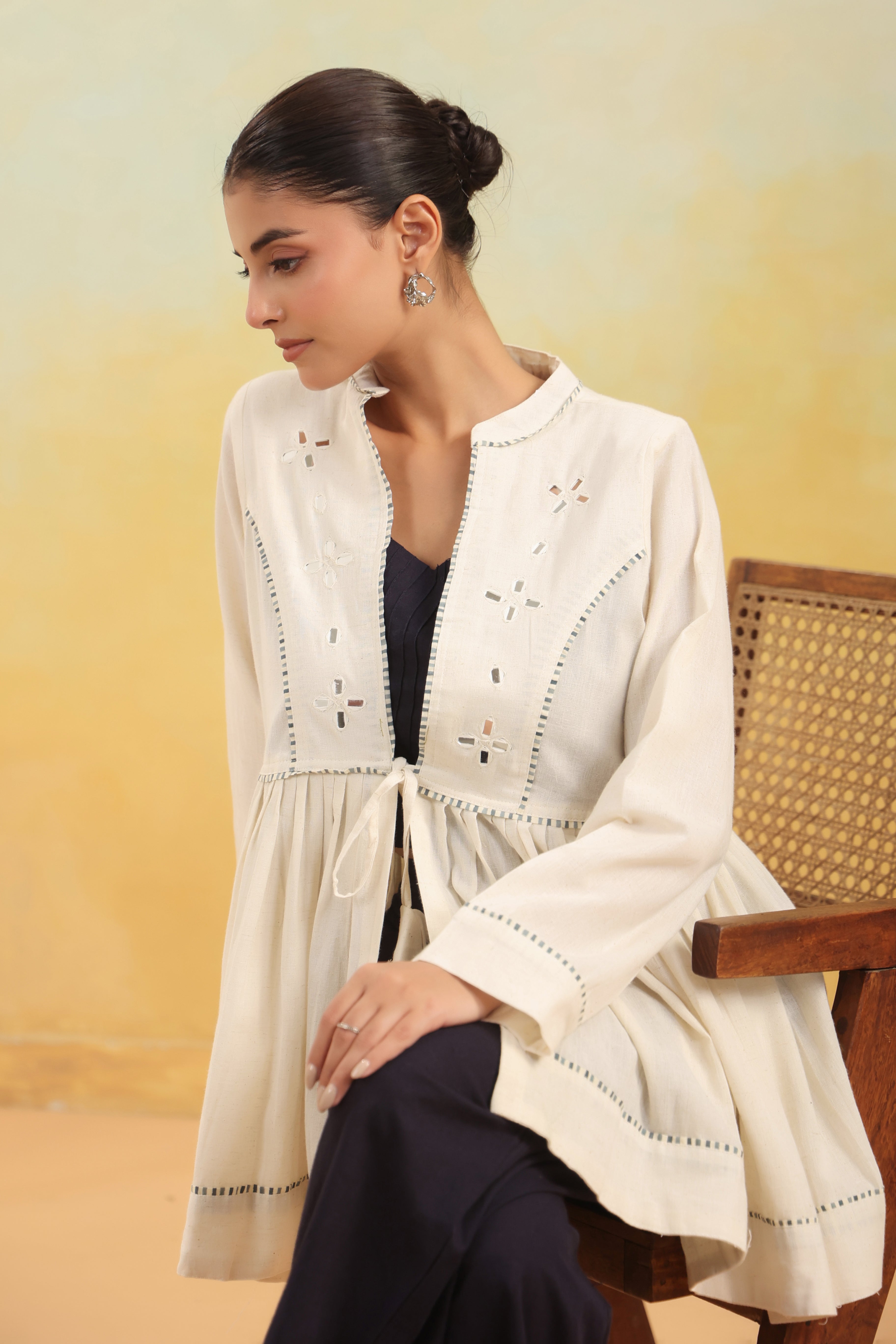 Women Off White Embroidered Peplum Top with Black Straight Pants Set
